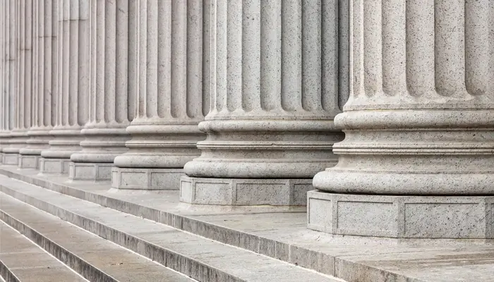 Close-up view of stone pillars of a courthouse