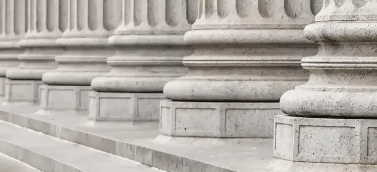 Close-up view of stone pillars of a courthouse